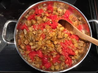 tomatoes added to eggplant